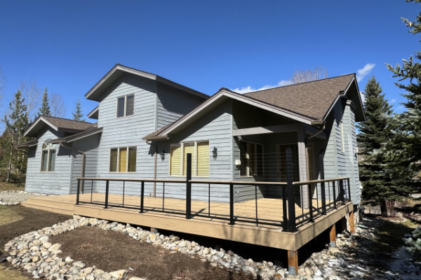 Soft tan deck complementing stucco exterior