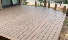 Large wooden deck with five vertical planks for future railing