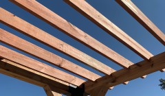 Support beams for partially-constructed wooden gazebo roof