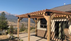 Partially constructed wooden cover for concrete back patio
