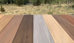 Wood deck with ten shades of planks and no railing overlooking snowy mountain top