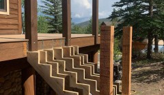 Framework for wooden staircase to wooden deck with vertical wood support beans